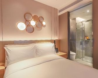 Orange Hotel (Tianjin Wudadao) - טיאנג'ין - חדר שינה