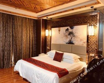 Canghai Qingya Hotel (Wuzhou High-Speed Rail South Station) - Wuzhou - Bedroom