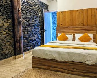 Gantavya Resort - פוחארה - חדר שינה