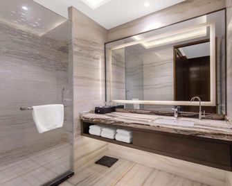 Zhenbao Holiday Hotel (Nanjing Olympic Sports Center) - Nanjing - Bedroom