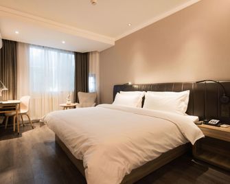 Hanting Premium Hotel (Xining Shengli Road Commercial Lane) - Xining - Bedroom