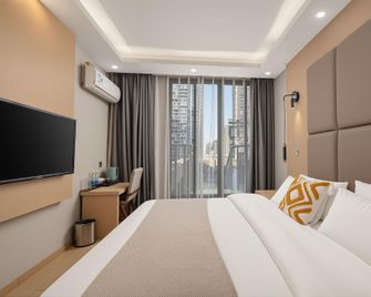 Hangcheng Garden Cafe Hotel - Kunming - Bedroom
