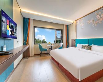 Qufu Mingzuo Xingtan Hotel - Jining - Schlafzimmer
