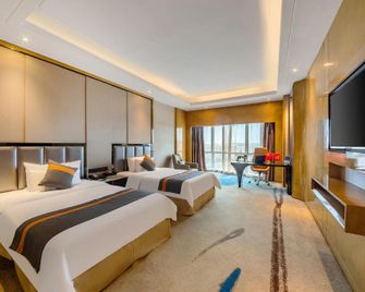 Sweet Fruit Charm International Hotel (Foshan West Station Shati Airport Store) - Fo-šan - Ložnice