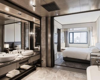 Hawaii International Hotel - Mudanjiang - Bedroom