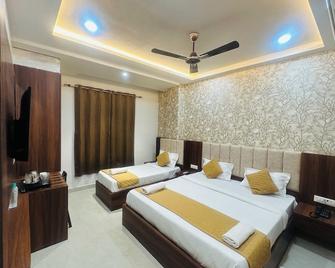 hotel deep palace - Varanasi - Schlafzimmer