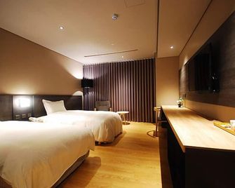 Chiayi Guanzhi Hotel - צ'יאי - חדר שינה