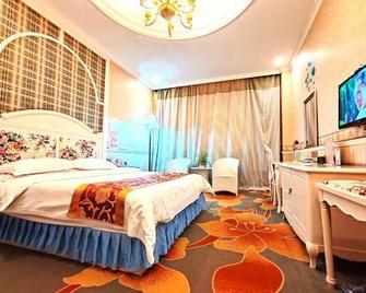 Wangfu Holiday Hotel - Xinzhou - Спальня