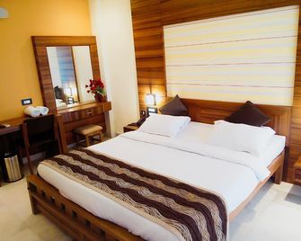 Hotel Madhuvan Serai - Manipala - Camera da letto