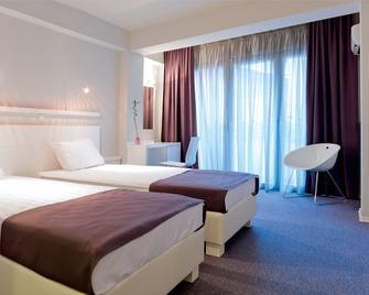Leonardo Hotel - Skopje - Schlafzimmer