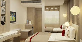 Days Hotel by Wyndham Jaipur Tonk Road - Jaipur - Bedroom