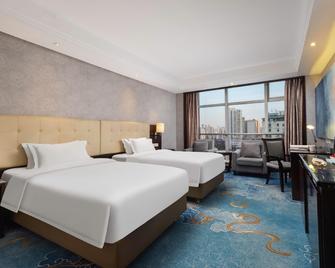 Huihao Hotel Wuhan - Wuhan - Schlafzimmer