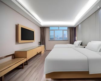 Lavande Hotels Urumqi Diwopu International Airport - Ürümqi - Soveværelse