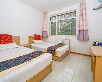 Qingdao Guanhai Coast Apartment - Qingdao - Sypialnia