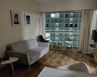 5 star service apartment opp airport - Surat - Living room