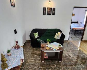 Stylish apartment on Goa's most happening stretch, bang on the Chapora River, - Siolim - Living room