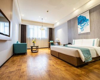 Xana Lite Hotel (Zigong Bus Terminal) - Zigong - Bedroom