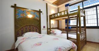 Wo Niu Downtown Inn - Lanzhou - Bedroom