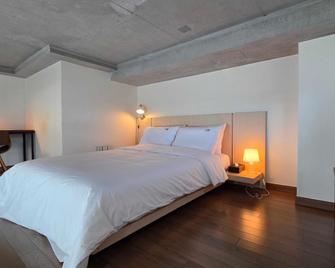 Geojedo Okpo Jinwoo Prestige Hotel - Geoje - Slaapkamer