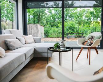 Stijlvol ingerichte (4 pers.) bungalow in Baarland - Baarland - Sala de estar