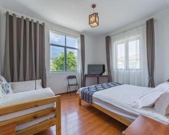 the Dragonfly Guesthouse - Dali - Schlafzimmer
