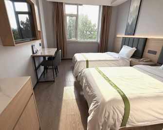 Greentree Inn Dongying Xisi Road Huachuang Building Business Hotel - Dongying - Спальня