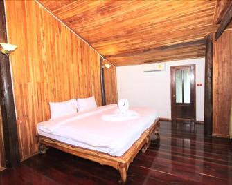 Tamarind Home Resort Kanchanaburi - קאנצ'אנאבורי - חדר שינה