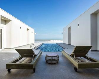 Oceanami Villas & Beach Club - Managed by Oceanami Group - Long hai - Schlafzimmer