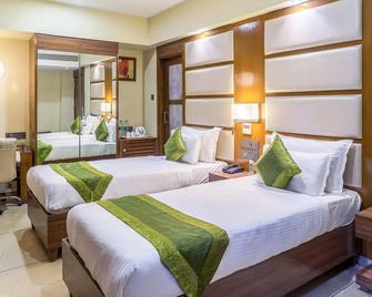 Super Inn Armoise Hotel - Ahmedabad - Bedroom