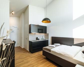 We rooms Hotel - Karben - Schlafzimmer