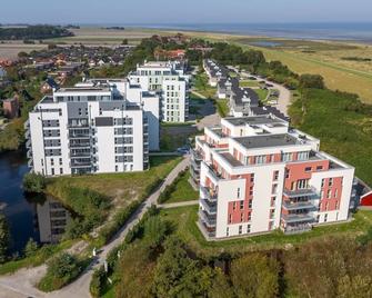Great North Sea apartment with 54 sqm roof terrace, sea view, sauna and wood-burning stove! - North Sea Resort - Schillig - Gebäude