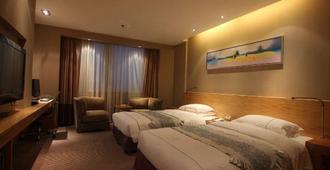 Sunny Resort Hotel - Dandong - Schlafzimmer