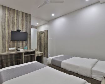 Hotel Limra Vadodara - Vadodara - Schlafzimmer