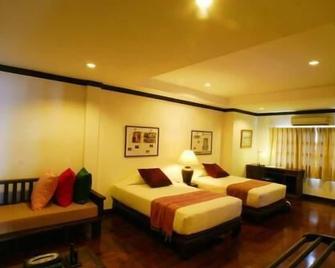 Cucumber Inn Suites - Pattaya - Schlafzimmer