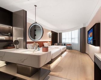 Xingang Holiday Hotel(Xinzheng International Airport Shop) - Zhengzhou - Bedroom