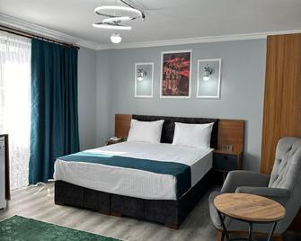 Asgard Hotel - באליקסיר - חדר שינה