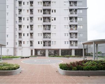 Best Choice 2BR at Puncak Dharmahusada Apartment Surabaya By Travelio - Surabaya - Edifício