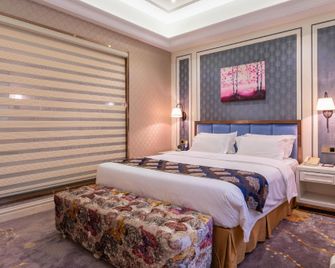 Zhongshan Huangcheng Louis Hotel - Zhongshan - Slaapkamer