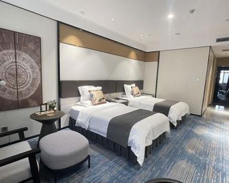 Wanjie International Hotel - Zibo - Schlafzimmer