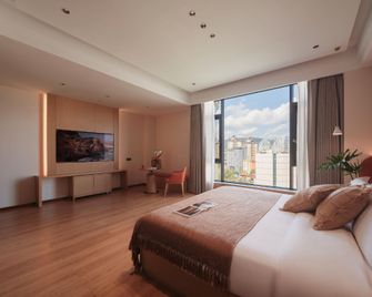 Shanxi Grand Hotel - Xishuangbanna - Habitación