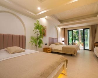 W Resort (Gaozhuang Star Night Market) - Xishuangbanna - Slaapkamer