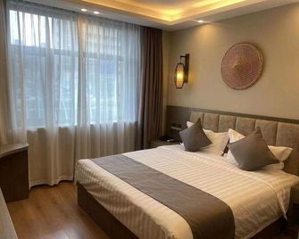 Lutaichun Culture Theme Hotel - Tianjin - Schlafzimmer