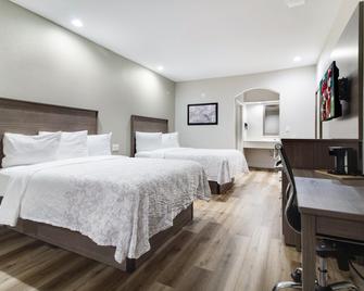 Red Roof PLUS+ Galveston - Beachfront - Galveston - Bedroom