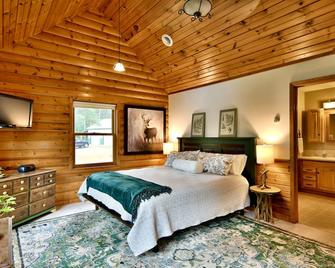 Family-friendly cabin w/ king beds, theater, gentle slope; near town & trails - Spooner - Bedroom