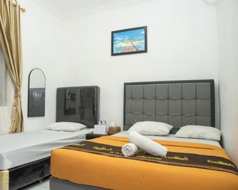 Djs Homestay Syariah - Bandar Lampung - Bedroom