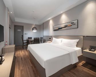Jili Hotel (You'an International Plaza) - Shaoyang - Bedroom