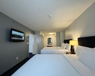 Divya Sutra Plaza and Conference Centre Calgary Airport - Calgary - Bedroom