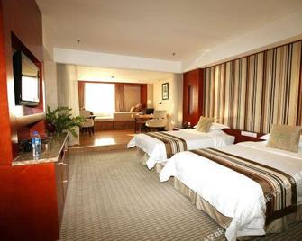 Iris Orchard All Suites Hotel (Tangshan Convention Center) - Tangshan - Habitación