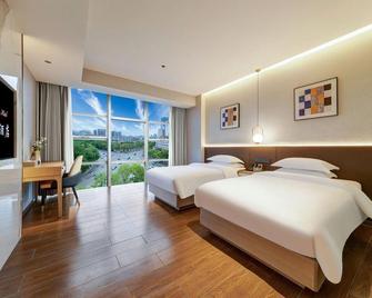 Hanzhong Liangju Hotel (Hanzhong High Speed Railway Station Central Hospital) - Hanzhong - Bedroom