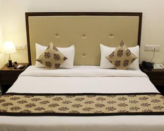 Eco Inn Hotel - Джамнагар - Спальня